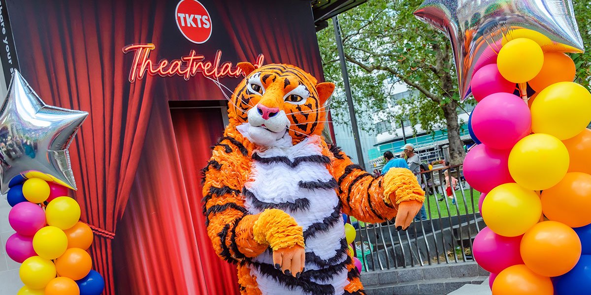 The Tiger character stands outside the TKTS booth