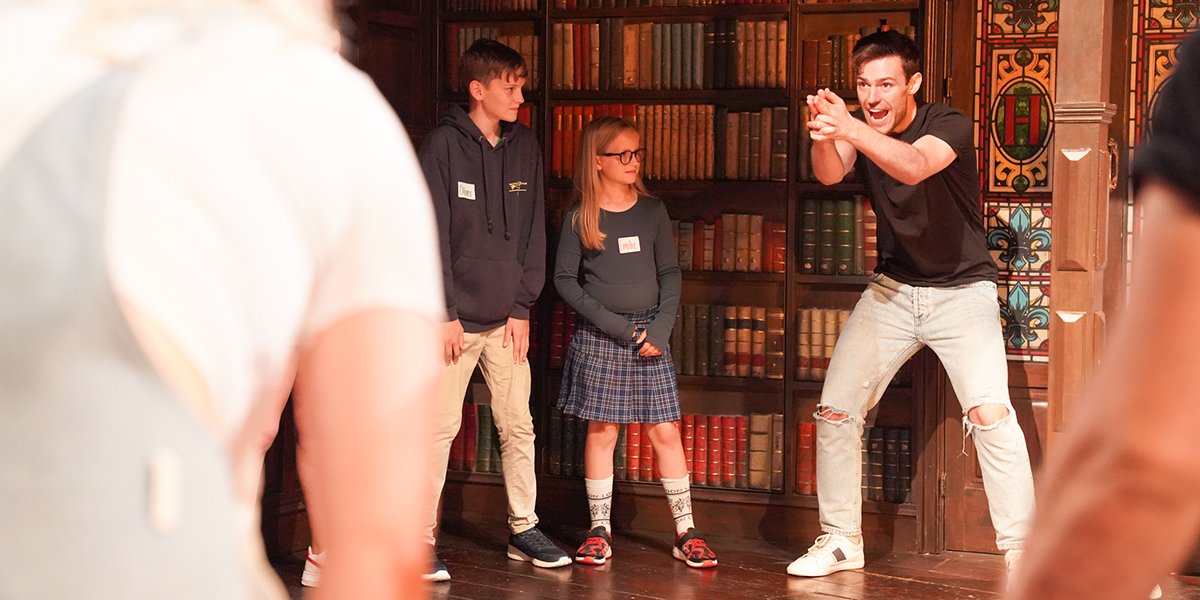 Children enjoying the Kids Week stage combat workshop at The Play That Goes Wrong