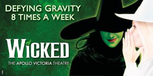 A green banner featuring the title "Wicked" with a textured background and ticket details.